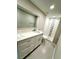 Bathroom with double vanity, stylish tile, and modern fixtures at 5611 Riddle Rd, Holiday, FL 34690