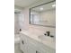 Modern bathroom with white cabinets and quartz countertop at 5611 Riddle Rd, Holiday, FL 34690