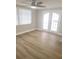 Bedroom with French doors and laminate wood floor at 5611 Riddle Rd, Holiday, FL 34690