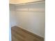 Spacious closet with wood laminate flooring and shelving at 5611 Riddle Rd, Holiday, FL 34690