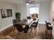 Modern dining area with concrete table and stylish chairs at 5611 Riddle Rd, Holiday, FL 34690