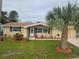 Charming ranch home with updated landscaping and curb appeal at 5611 Riddle Rd, Holiday, FL 34690