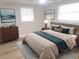 Bright bedroom with a king-size bed and neutral color scheme at 5611 Riddle Rd, Holiday, FL 34690