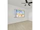 Bedroom with light wood laminate flooring and ceiling fan at 603 N Keene Rd # P12, Clearwater, FL 33755