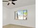 Bright bedroom with ceiling fan and large window at 603 N Keene Rd # P12, Clearwater, FL 33755