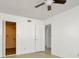 Bright bedroom with ceiling fan and access to another room at 603 N Keene Rd # P12, Clearwater, FL 33755