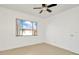 Bright bedroom with large window and ceiling fan at 603 N Keene Rd # P12, Clearwater, FL 33755