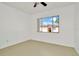 Bedroom with laminate flooring and large window at 603 N Keene Rd # P12, Clearwater, FL 33755