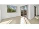 Bedroom with tile floors and sliding glass doors to balcony at 603 N Keene Rd # P12, Clearwater, FL 33755