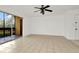 Living room with tile floor and access to balcony at 603 N Keene Rd # P12, Clearwater, FL 33755