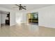 Bright living room with tile floors and sliding glass doors at 603 N Keene Rd # P12, Clearwater, FL 33755