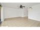 Bright and airy living room with tile floors and ceiling fan at 603 N Keene Rd # P12, Clearwater, FL 33755