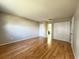Hardwood floors and closet space in a well-lit, neutral-toned bedroom at 6441 Drexel Dr # 7, Port Richey, FL 34668