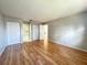 Bright bedroom with hardwood flooring, closet space, and neutral paint at 6441 Drexel Dr # 7, Port Richey, FL 34668