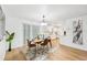 Modern dining area with a wooden table and stylish decor at 6514 Mariner Blvd, Spring Hill, FL 34609