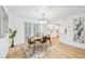 Modern dining area with hardwood floors and stylish decor at 6514 Mariner Blvd, Spring Hill, FL 34609