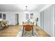 Bright dining room with a wooden table and modern chandelier at 6514 Mariner Blvd, Spring Hill, FL 34609