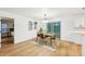 Elegant dining area with a wooden table and modern chandelier at 6514 Mariner Blvd, Spring Hill, FL 34609