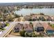 Aerial view of a luxury home community near the lake at 6648 Sunset Vista Way, Land O Lakes, FL 34637