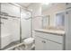 Modern bathroom with granite countertop and walk-in shower at 6648 Sunset Vista Way, Land O Lakes, FL 34637