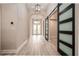 Bright entryway with wood-look floors and modern barn door at 6648 Sunset Vista Way, Land O Lakes, FL 34637