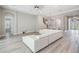 Bright living room with white sectional sofa and light wood flooring at 6648 Sunset Vista Way, Land O Lakes, FL 34637