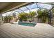 Screened pool and patio area with outdoor kitchen at 6648 Sunset Vista Way, Land O Lakes, FL 34637