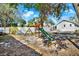 Backyard with playset, patio, and fenced yard at 7503 Wakulla Dr, Temple Terrace, FL 33637