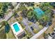 Community pool, tennis courts, and parking area at 7503 Wakulla Dr, Temple Terrace, FL 33637