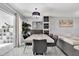 Dining area with marble table and gray chairs near the living room at 7503 Wakulla Dr, Temple Terrace, FL 33637