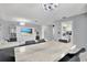 Bright dining room with marble table and gray chairs at 7503 Wakulla Dr, Temple Terrace, FL 33637