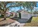 House exterior with garage and landscaping at 7503 Wakulla Dr, Temple Terrace, FL 33637