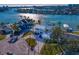 Aerial view of a modern waterfront home with a pool and private dock at 7810 10Th S Ave, St Petersburg, FL 33707