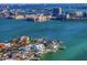 Aerial view of a waterfront community with various homes and lush landscaping at 7810 10Th S Ave, St Petersburg, FL 33707