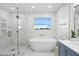 Luxurious bathroom with marble finishes, soaking tub, and walk-in shower at 7810 10Th S Ave, St Petersburg, FL 33707