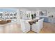 Dining room with wooden table, white chairs and views to the water at 7810 10Th S Ave, St Petersburg, FL 33707