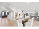 Bright dining room with farmhouse table and access to kitchen at 7810 10Th S Ave, St Petersburg, FL 33707