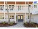 Elegant home entrance with double doors and a covered balcony at 7810 10Th S Ave, St Petersburg, FL 33707