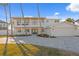 Stunning two-story home with a paved driveway and palm trees at 7810 10Th S Ave, St Petersburg, FL 33707