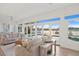 Relaxing living room with water views and light-colored furniture at 7810 10Th S Ave, St Petersburg, FL 33707