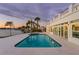 Inviting swimming pool and spa with waterfront view at sunset at 7810 10Th S Ave, St Petersburg, FL 33707