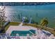 Luxury pool and patio area with a spa, offering stunning waterfront views at 7810 10Th S Ave, St Petersburg, FL 33707