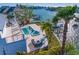 Waterfront pool and patio with spiral staircase and outdoor furniture at 7810 10Th S Ave, St Petersburg, FL 33707