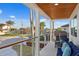 Covered porch with seating area and neighborhood views at 7810 10Th S Ave, St Petersburg, FL 33707