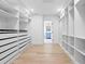 Large walk-in closet with ample shelving and drawers at 7810 10Th S Ave, St Petersburg, FL 33707