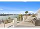 Relaxing waterfront deck with patio furniture, offering stunning water views at 7810 10Th S Ave, St Petersburg, FL 33707