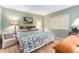 Serene bedroom with a floral patterned bedspread and soft natural light at 801 83Rd N Ave # 217, St Petersburg, FL 33702