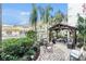 Courtyard with palm trees, pool, and outdoor seating at 801 83Rd N Ave # 217, St Petersburg, FL 33702