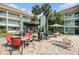 Outdoor courtyard with seating areas and tropical foliage, providing a serene and inviting atmosphere at 801 83Rd N Ave # 217, St Petersburg, FL 33702