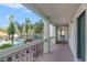 Condo hallway overlooking pool and palm trees at 801 83Rd N Ave # 217, St Petersburg, FL 33702